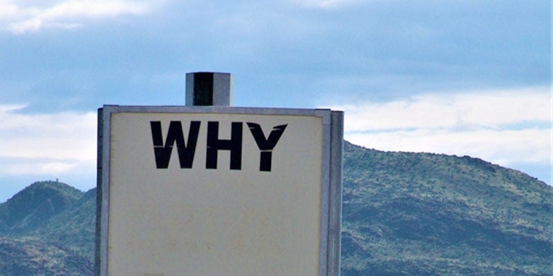 Road sign stating 'why'