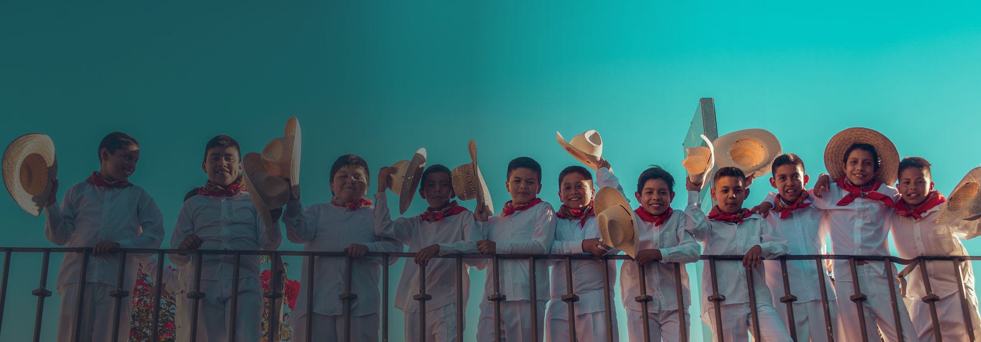 children lined up wearing sombreros