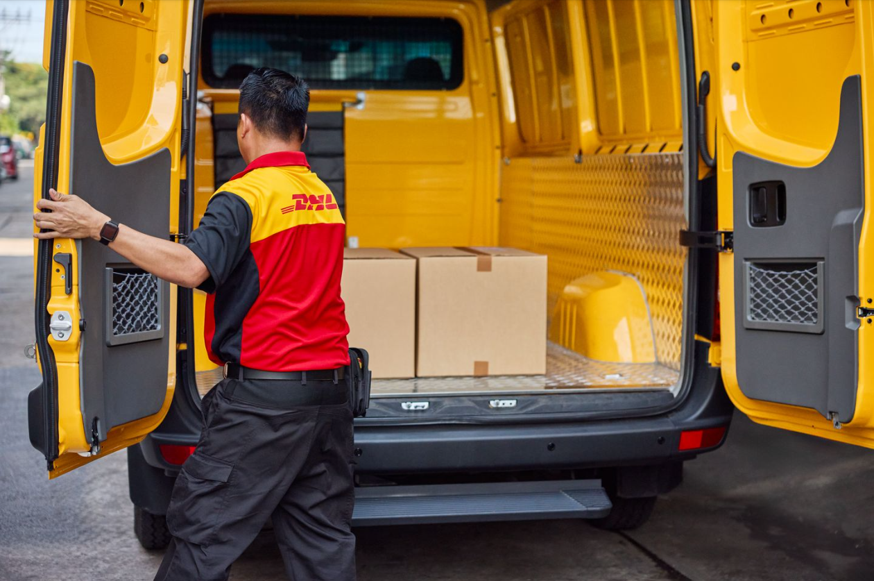 dhl employee preparing a delivery highlighting timely delivery as a key logistics trend