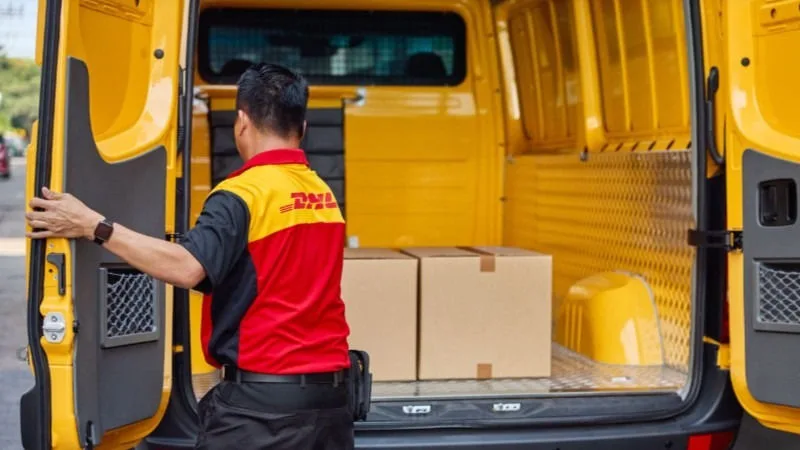 dhl-employee-loading-parcels-into-van
