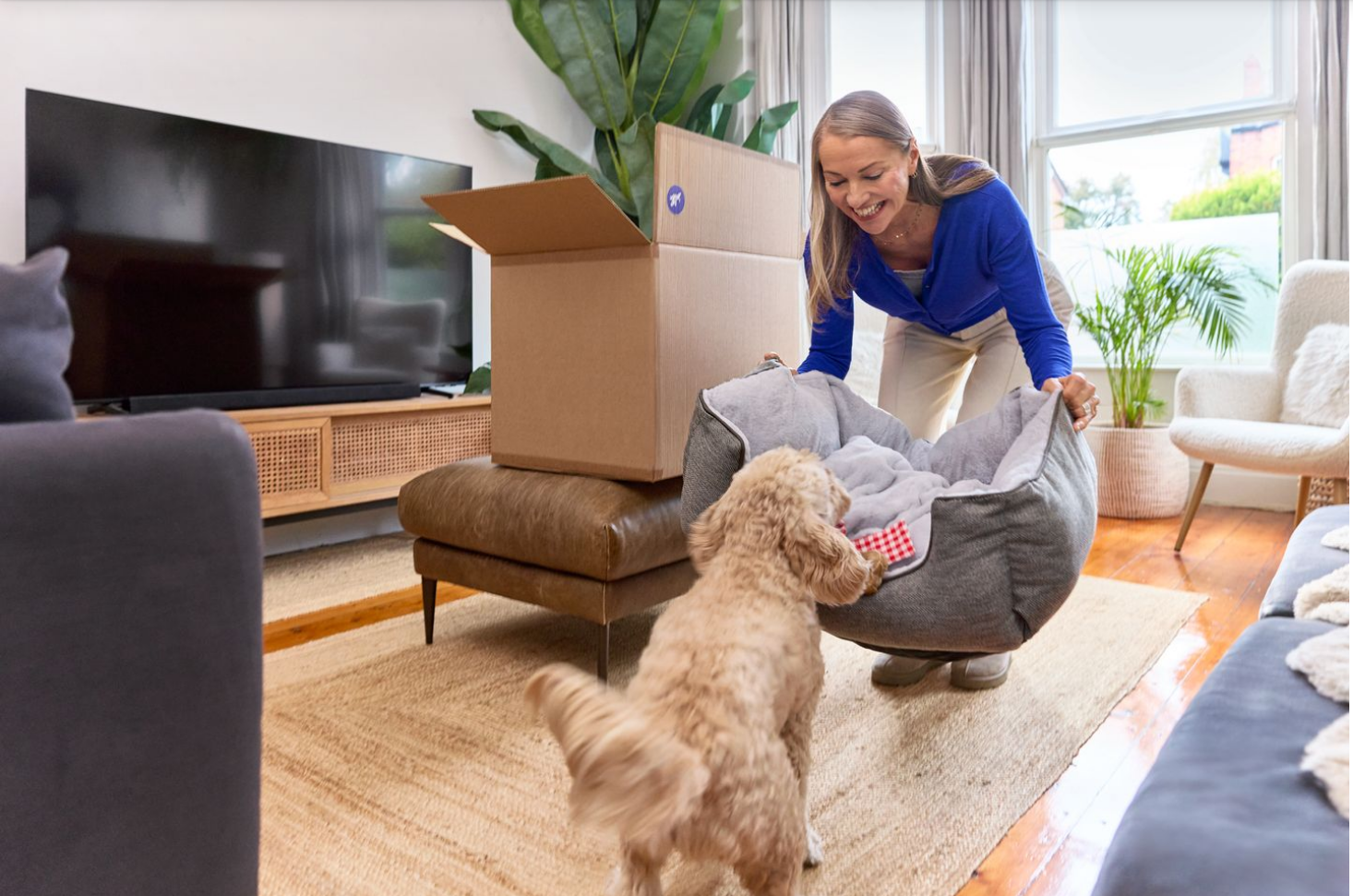 pet owner receiving dog bed from pet products fulfillment center