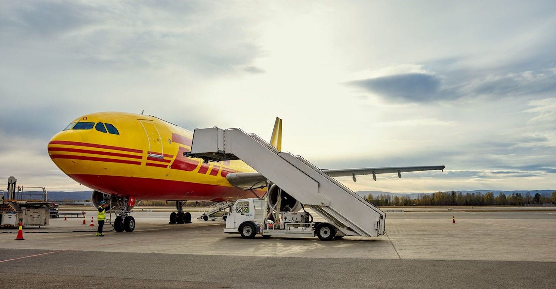 dhl express plane preparing for air cargo shipping in bangladesh, as part of their e-commerce solutions