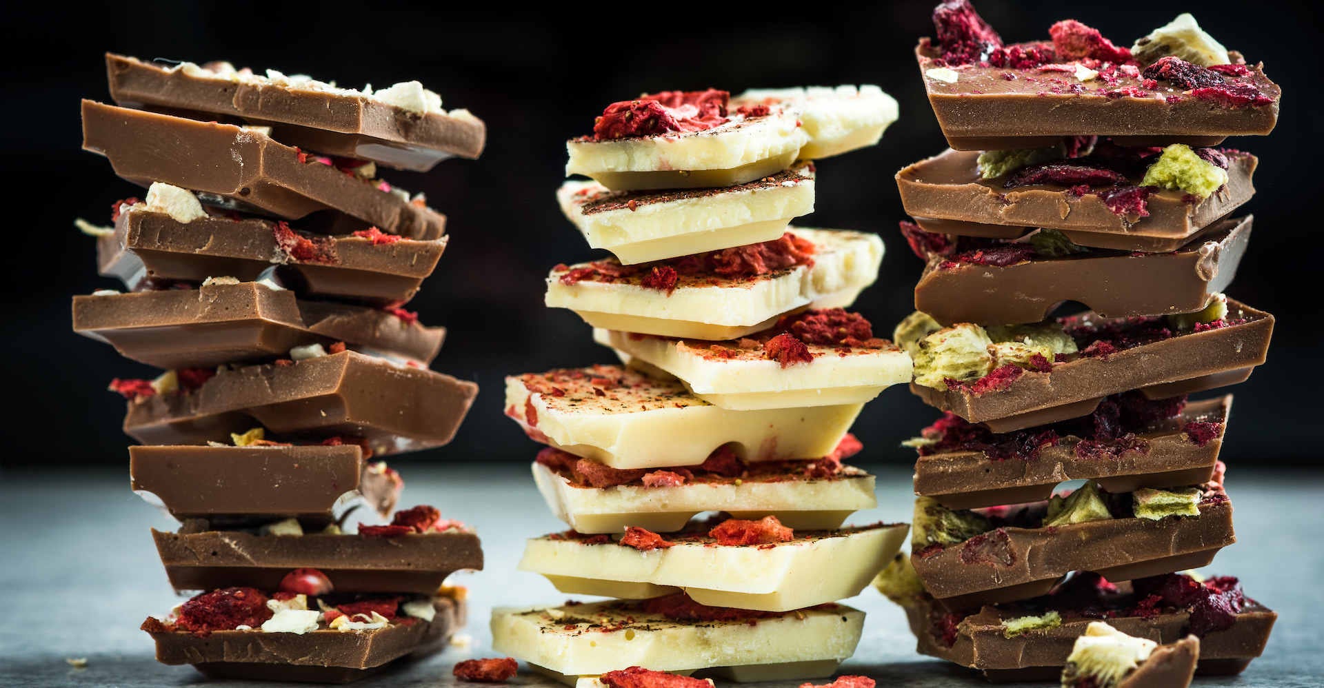 Handmade artisan chocolate pieces in stacks.