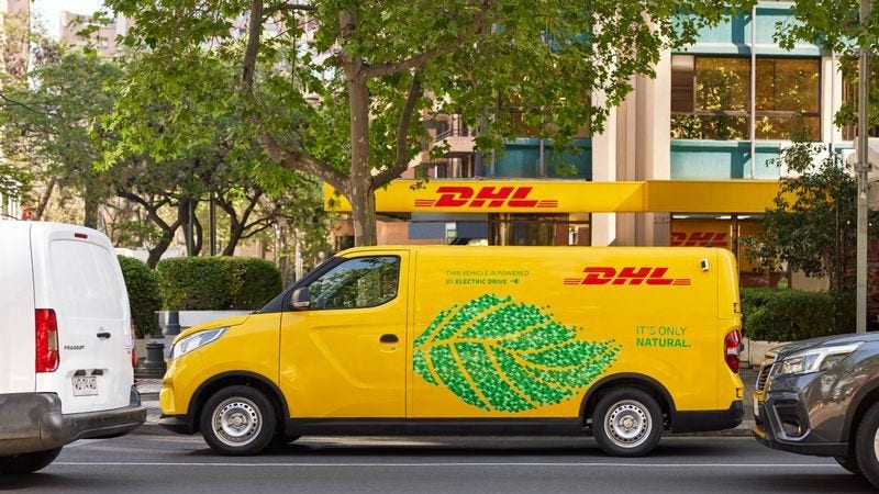 DHL Express electric van driving on a road