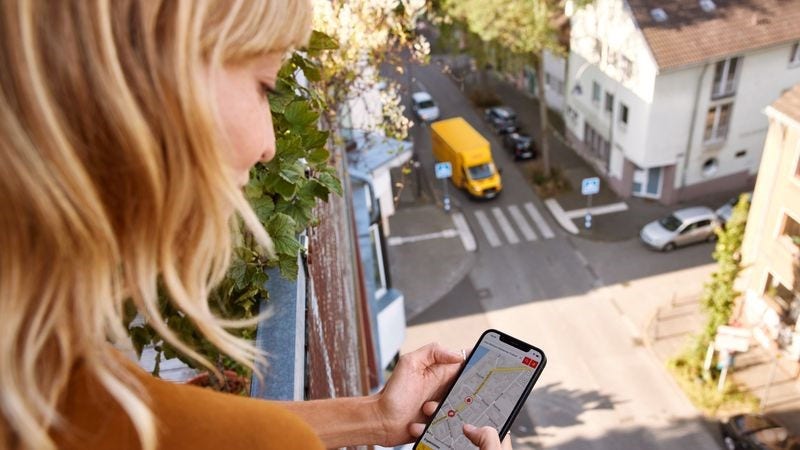 dhl express customer uses her phone to track her package