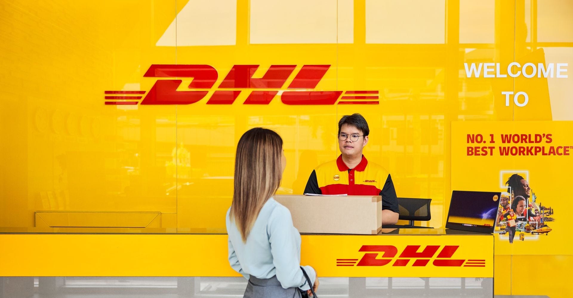 a customer is dropping off a laptop at dhl service point to ship it overseas