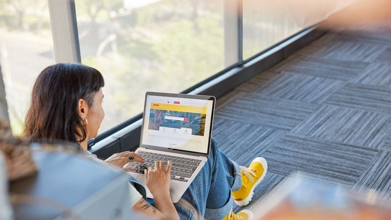 Young woman working on her laptop, exploring international shipping services for pineapple exports from Sri Lanka.