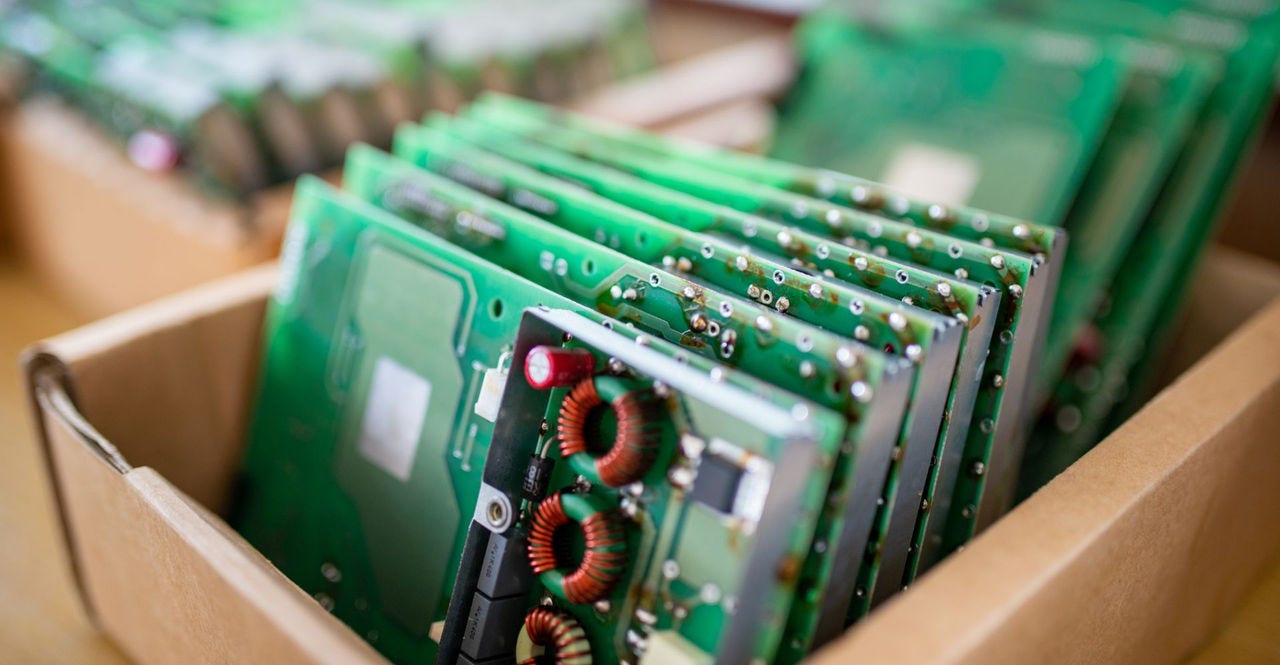 stacks of taiwan's pcbs in a cardboard package for shipping