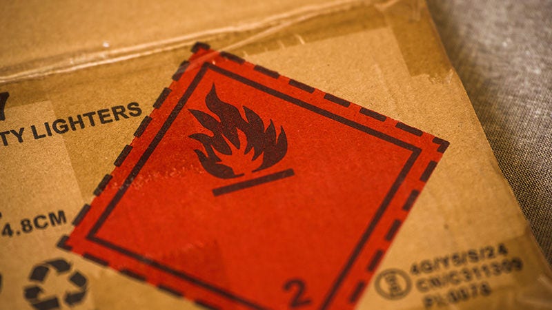 Cargo box with a flammable material warning label