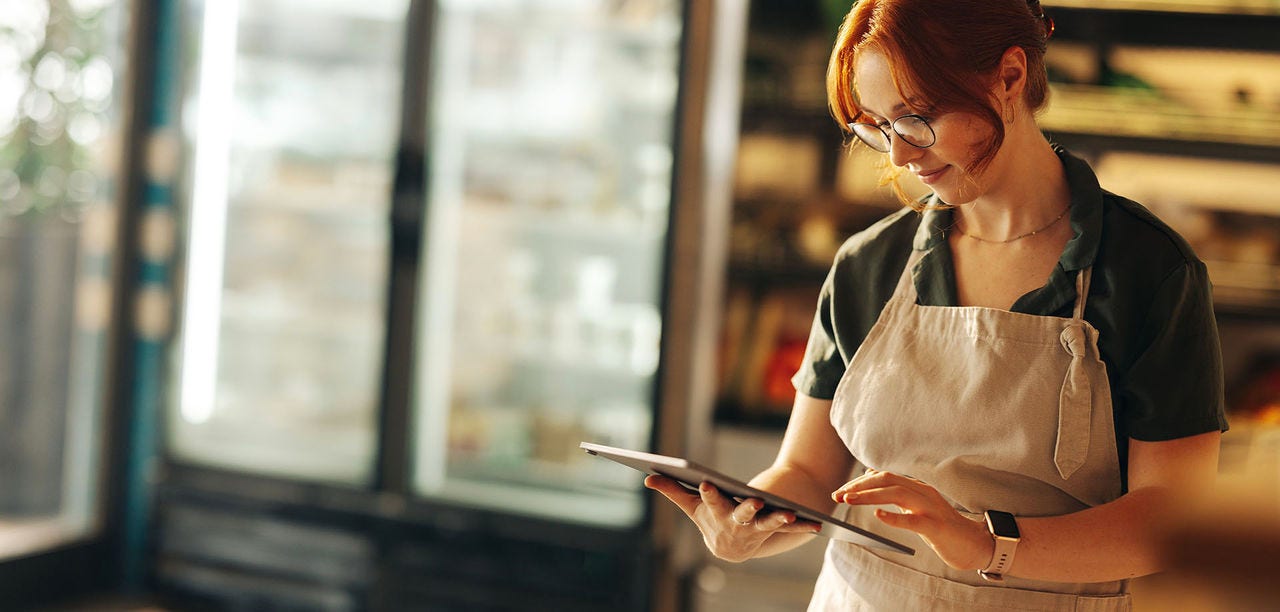 woman swiping on a tablet