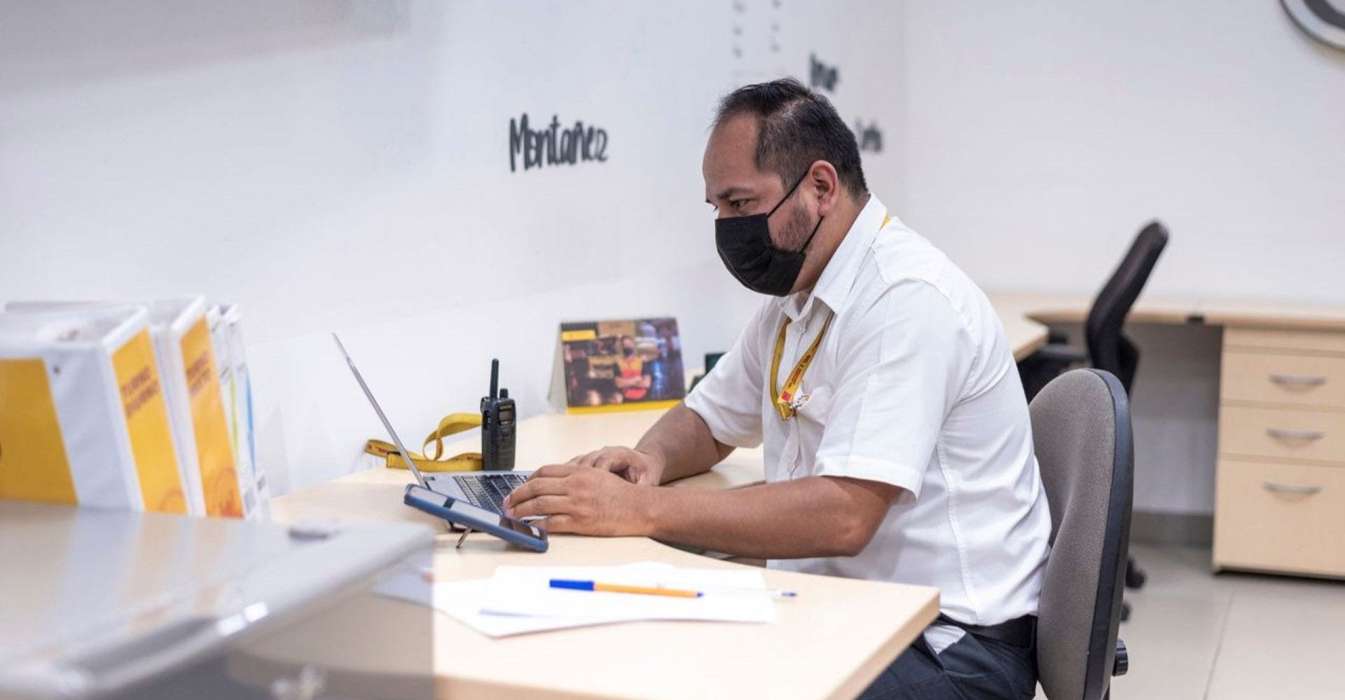 employee checking dead stock inventory on his laptop