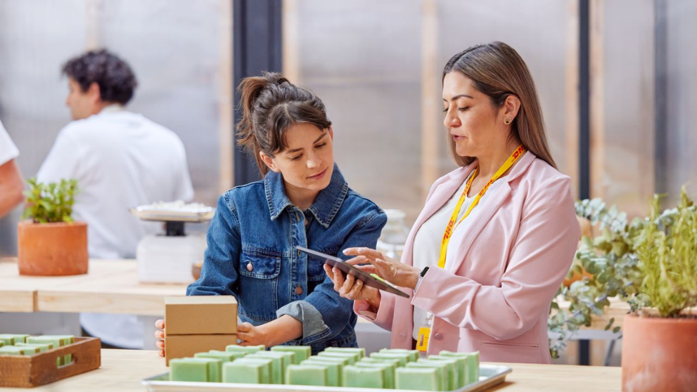 2 women discussing strategic business details on a tablet