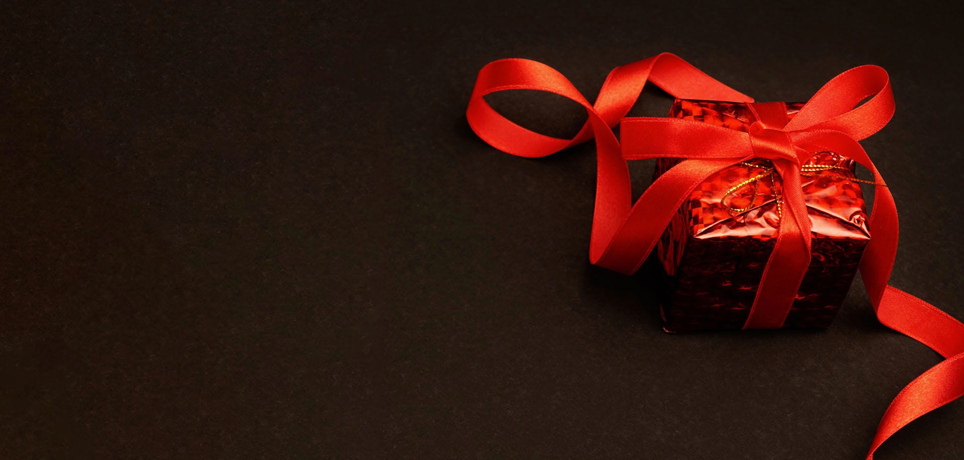 red present on a black background