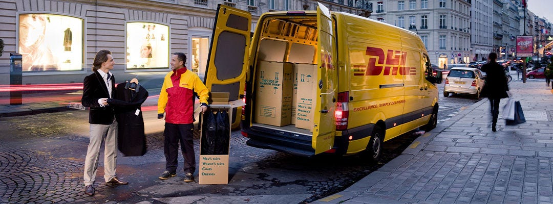 DHL courier and a man standing in front of a van