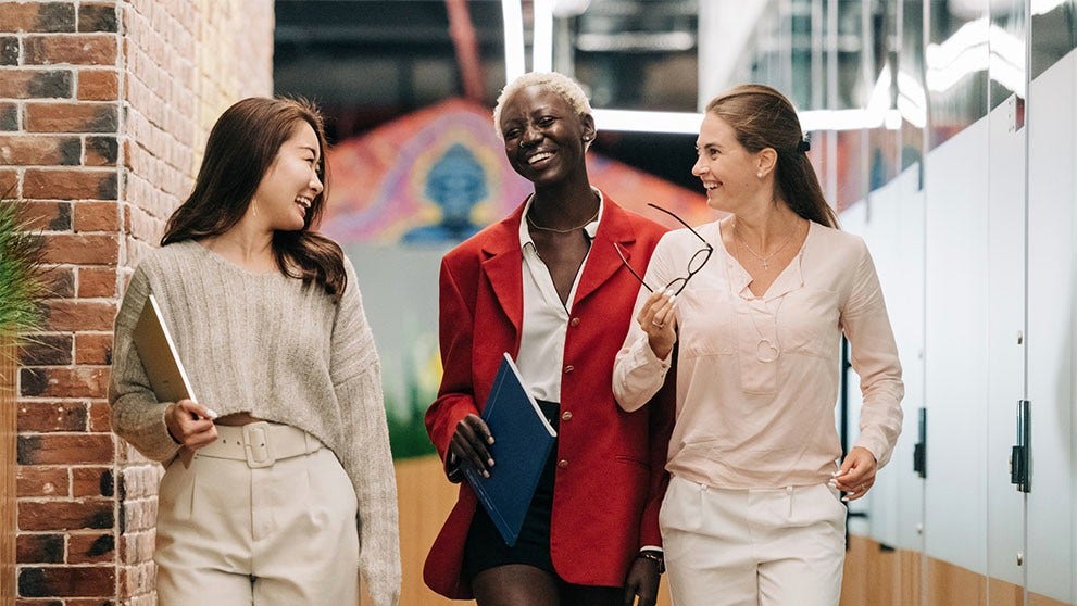 Three women smiling