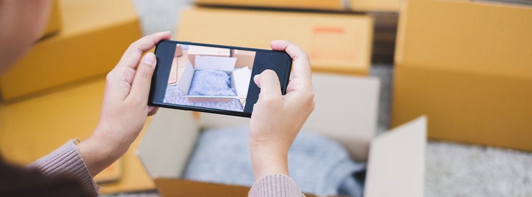 Young asian woman seller packing clothes product for online business, online shopping, shipping box and package