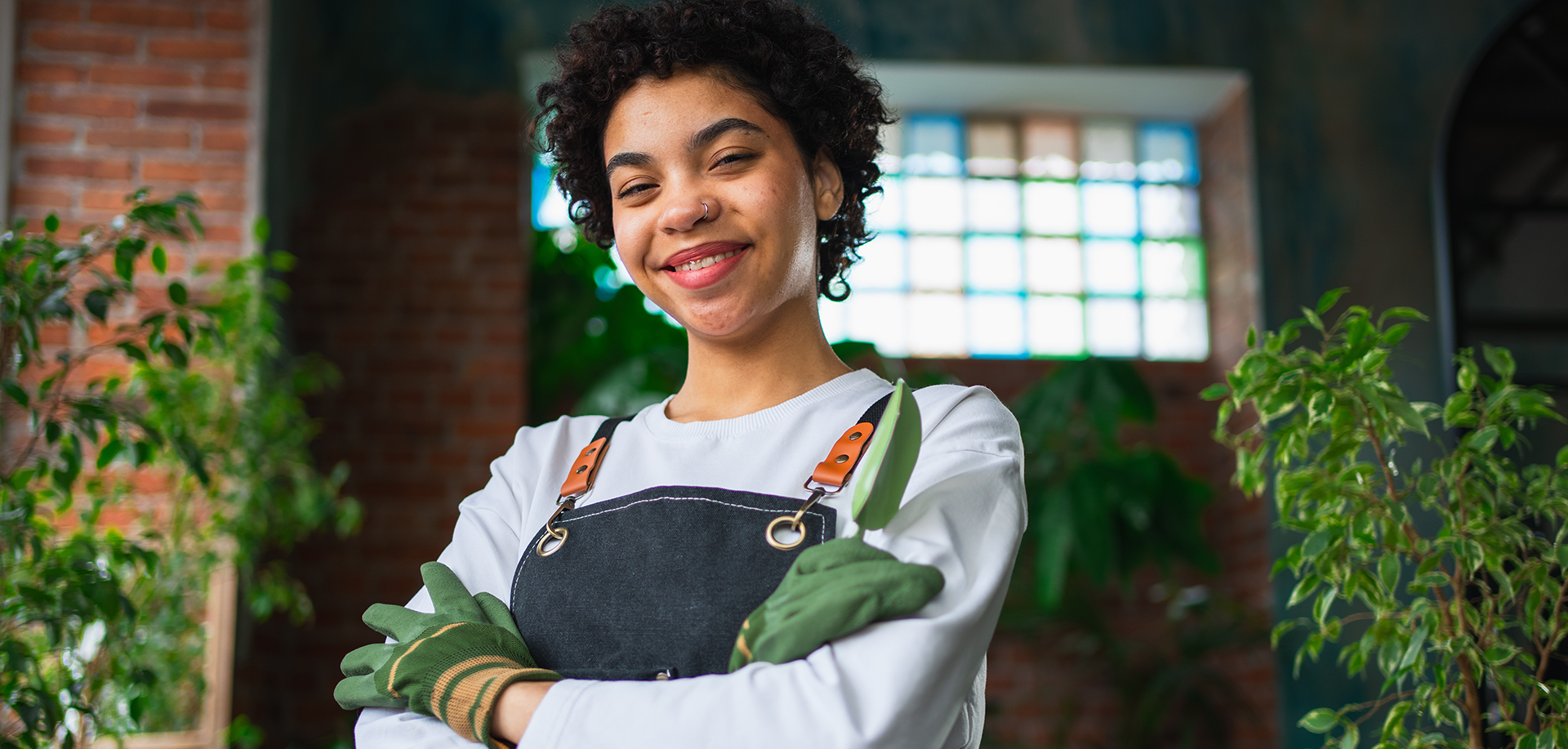woman in green gloves smiling