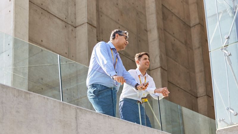 DHL employees having a discussion in the office