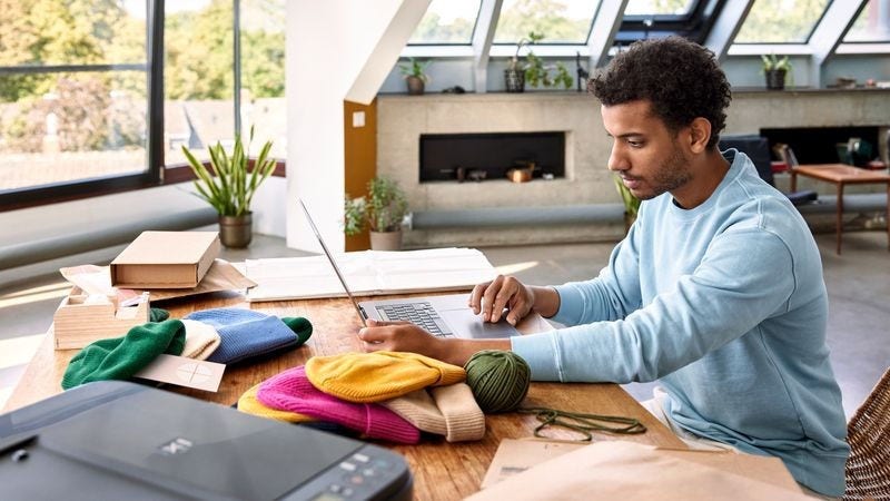 man checking his laptop