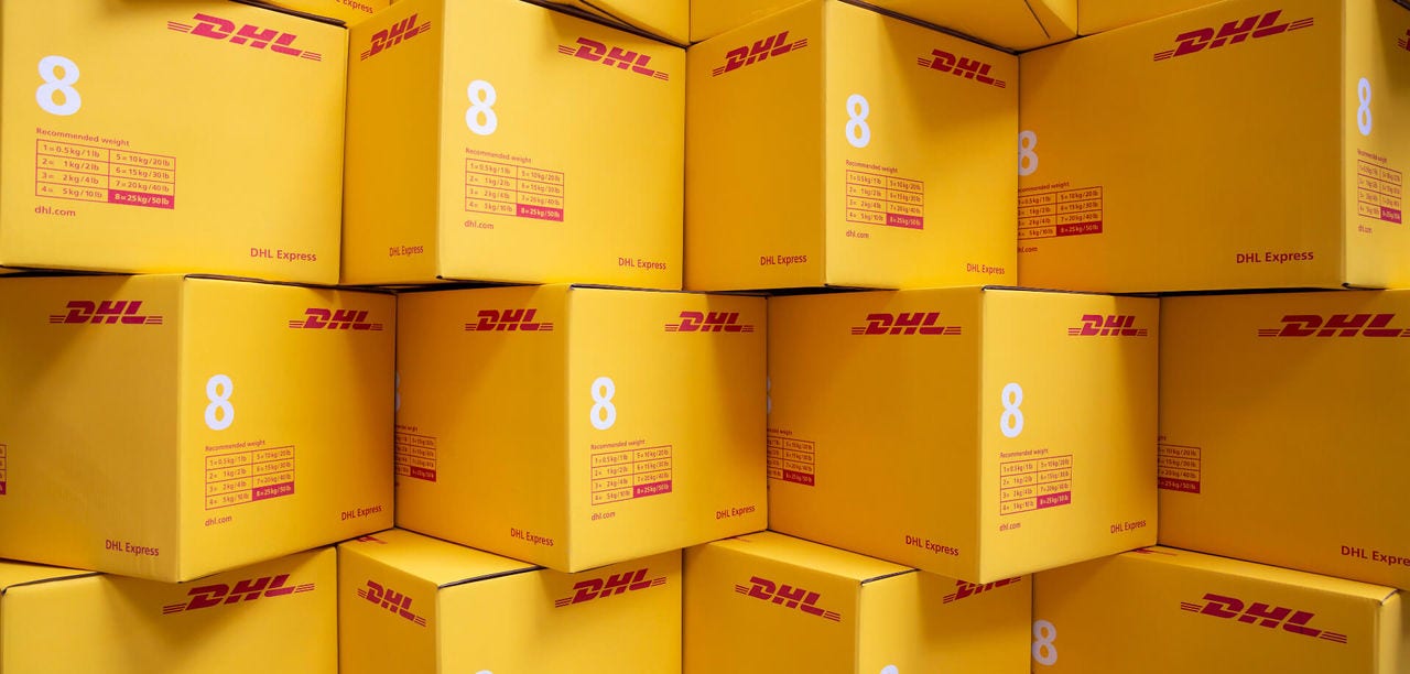 Stacks of DHL shipping boxes