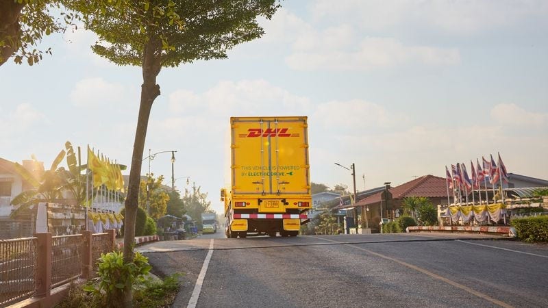 A DHL truck delivering packages as part of their international shipping services