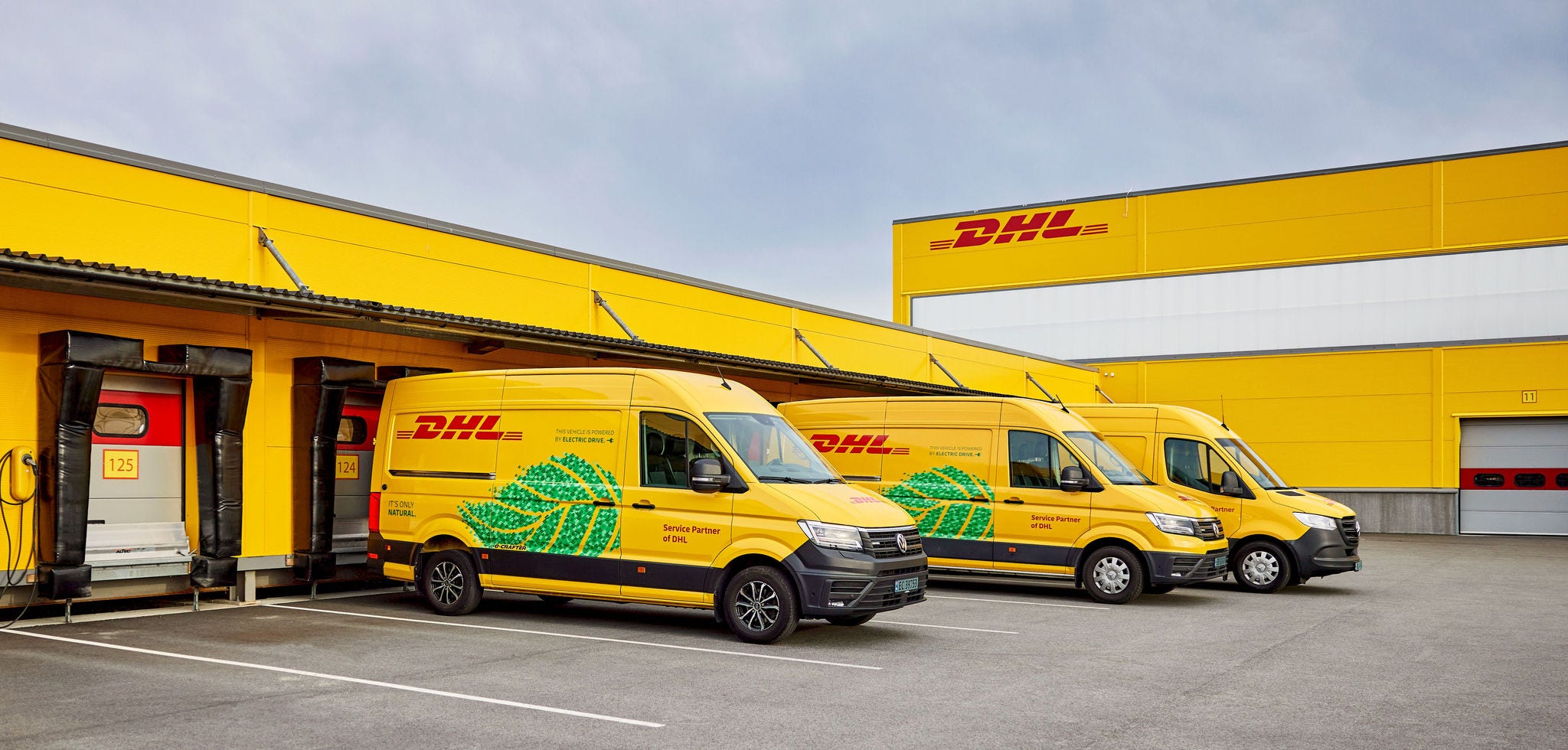 DHL vans at a facility