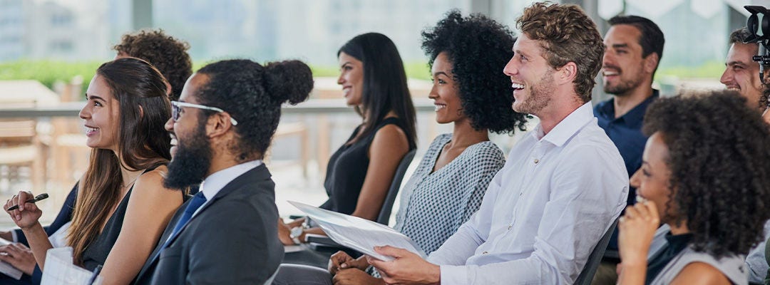 smiling people in a meeting