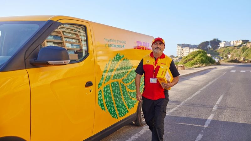 dhl express employee delivering parcel sustainably