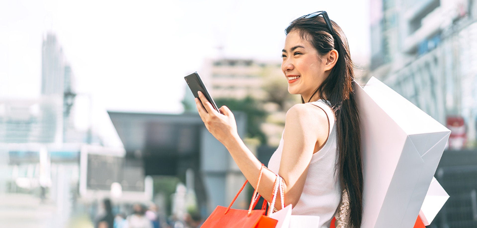 woman holding shopping bags