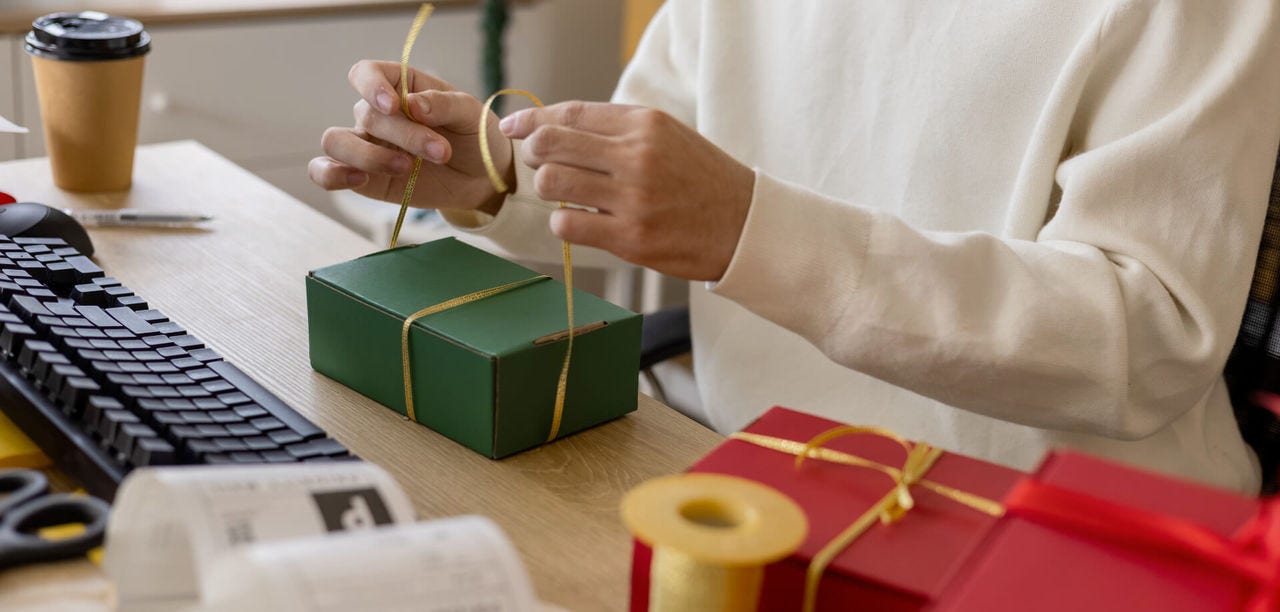 Preparing for peak holiday season by prepping boxes and ribbon