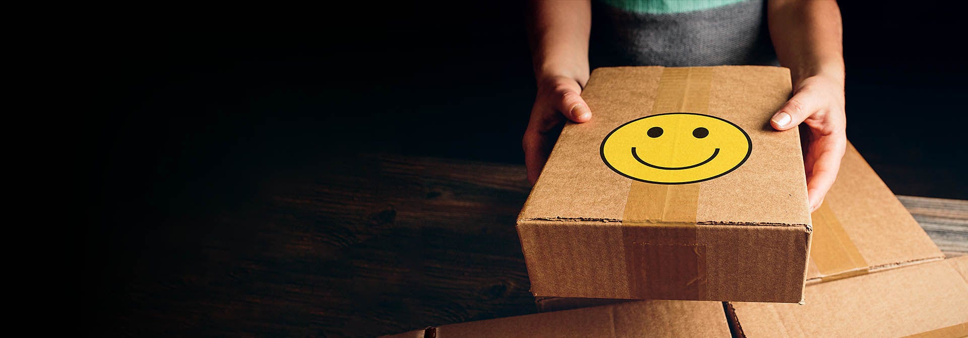 Hand holding brown package