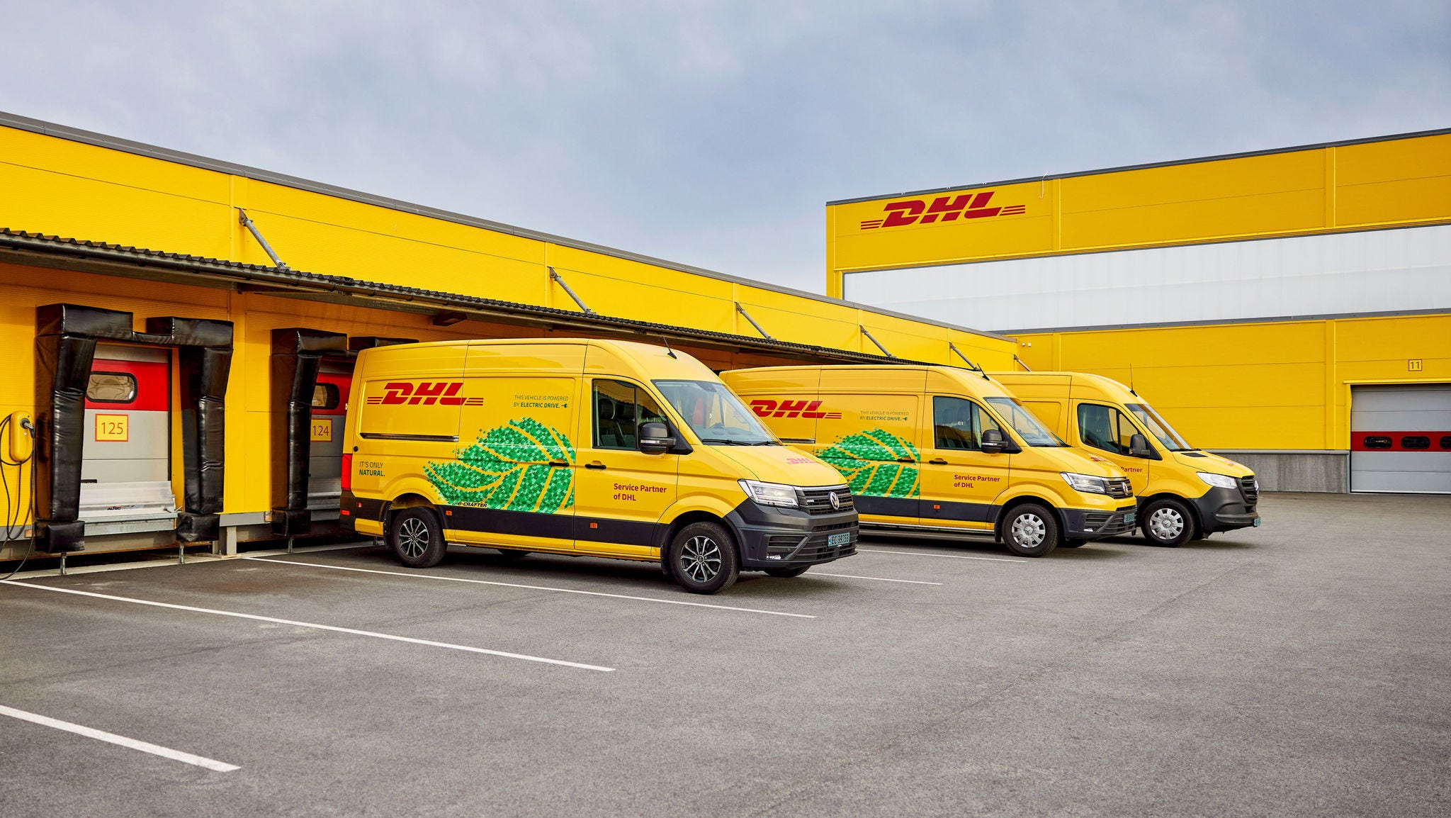 DHL vans at a facility