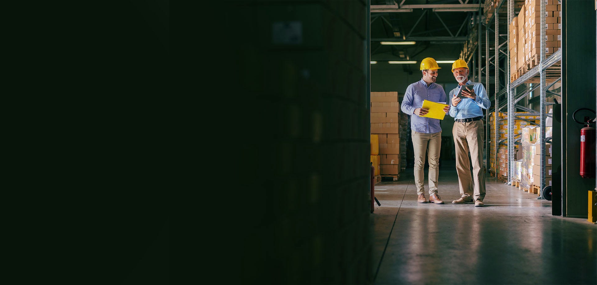 two men in a warehouse