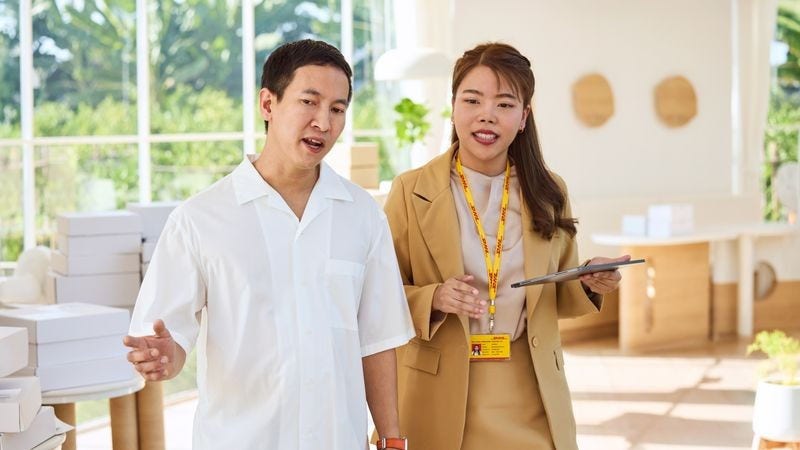 consignee talking to dhl employee about shipments