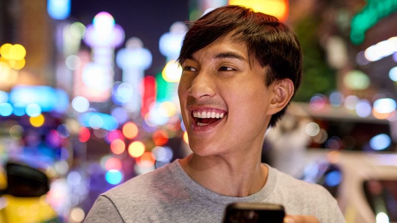 gen z consumer browsing through products on his mobile phone