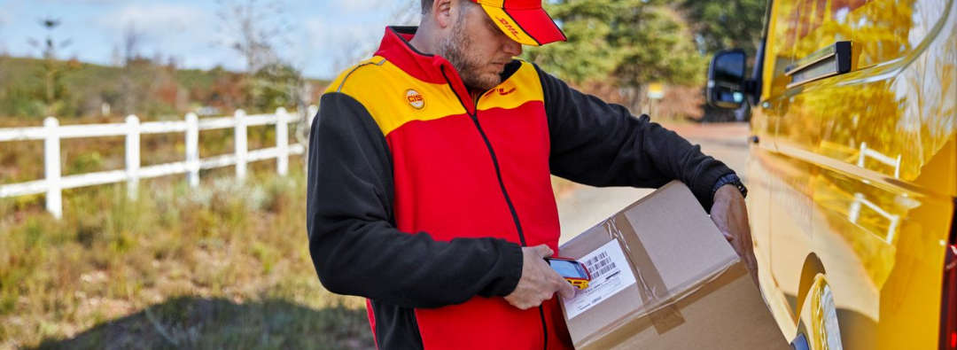 DHL Express courier holding a package