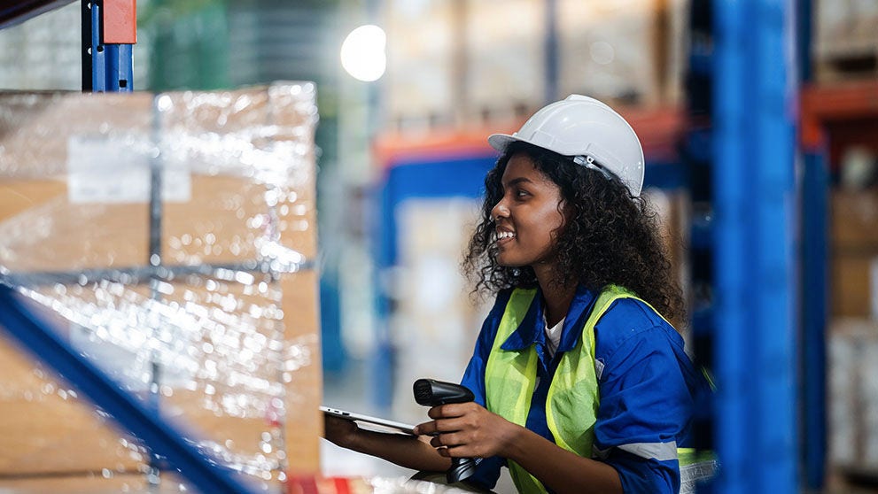 woman smiling in a warehouse