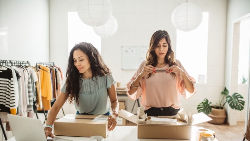 Inline Static ( 800x450)  - Female business owners taking picture and using laptop 
