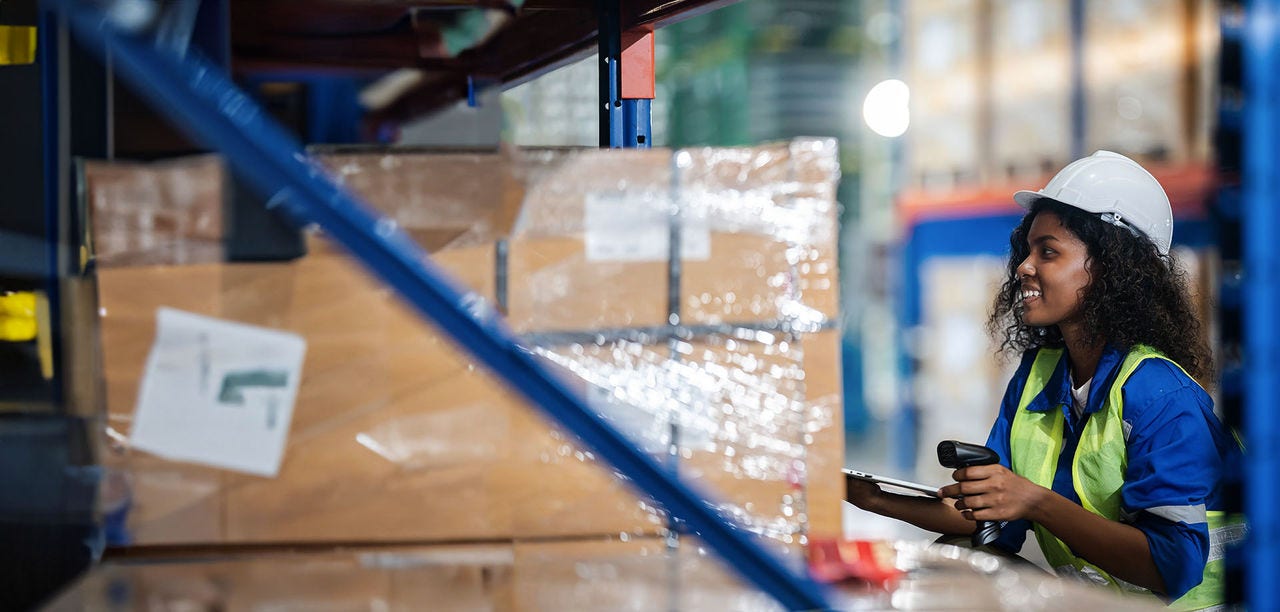 woman smiling in a warehouse
