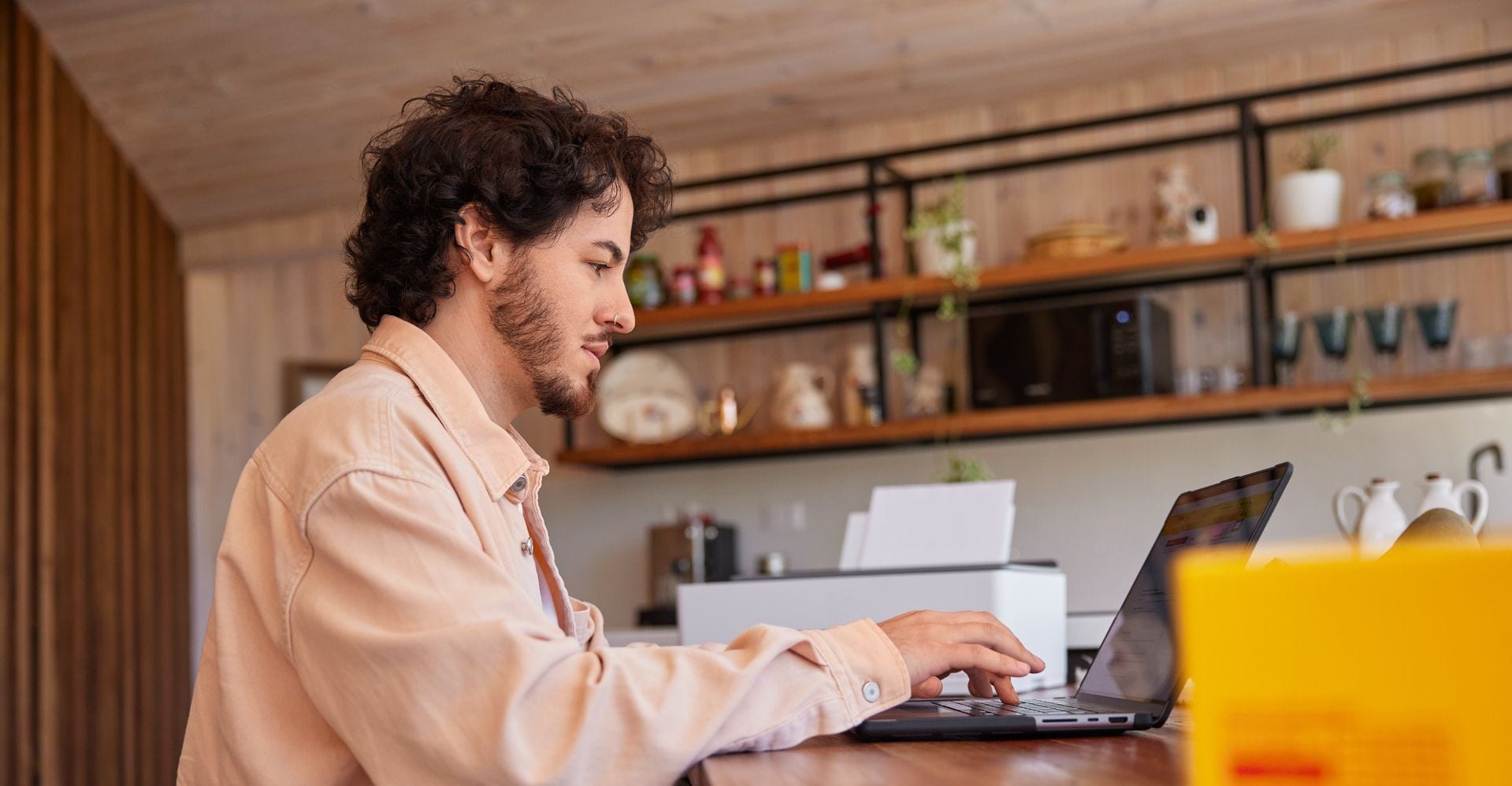 A man using his laptop at home to complete the FDA registration