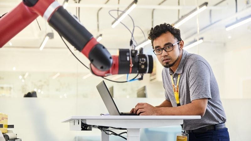dhl staff operating roboting arm