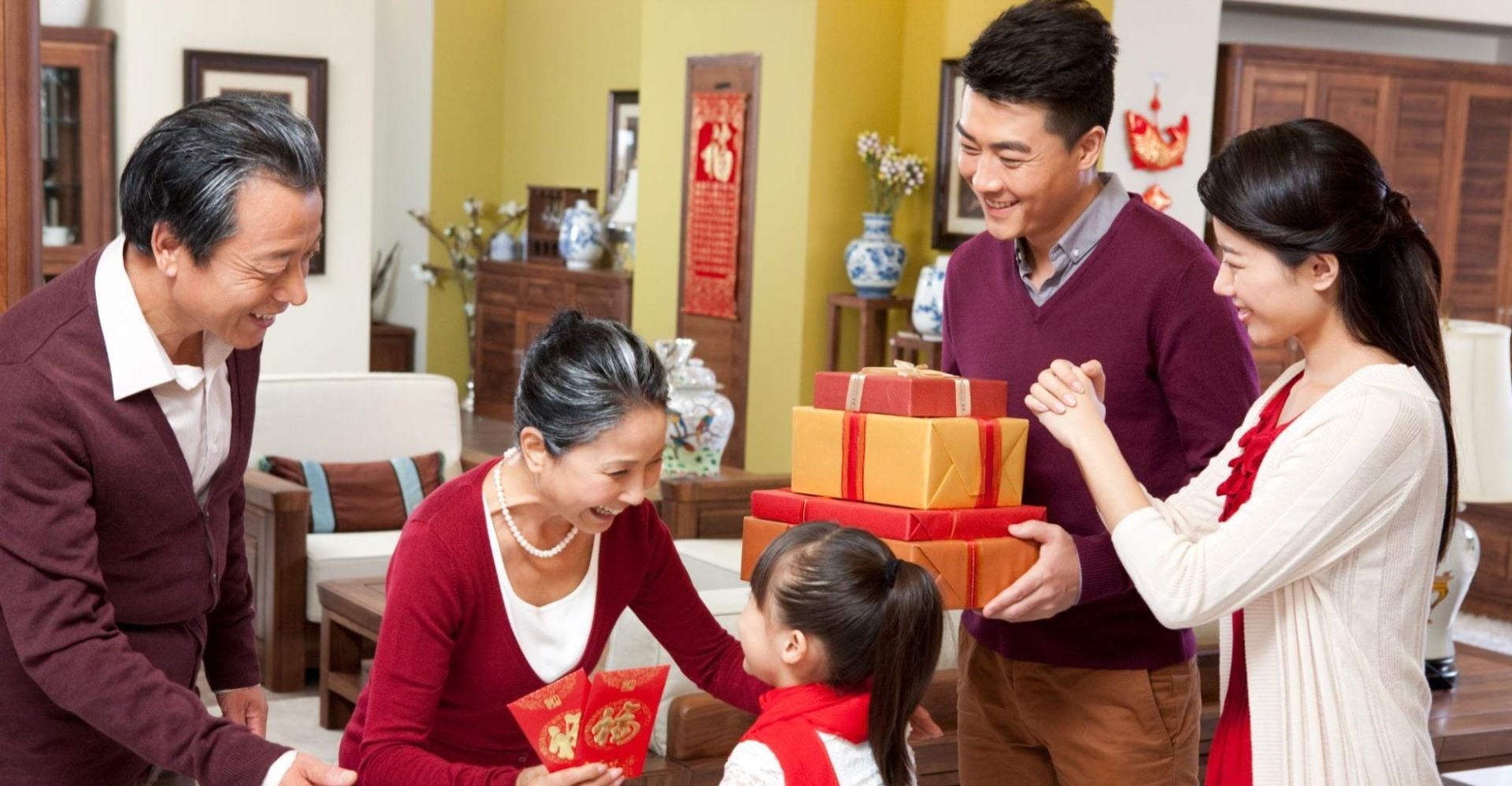 family visiting each other with gifts during chinese new year
