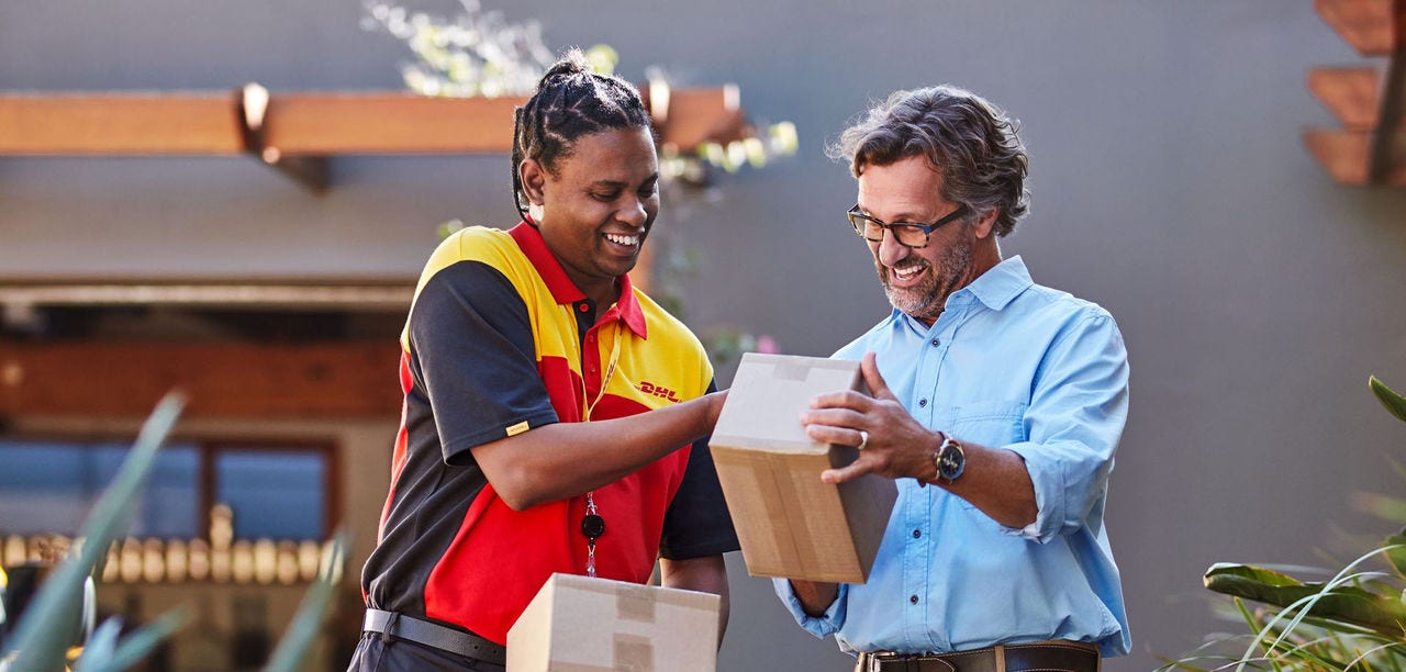 DHL courier handing a man a parcel
