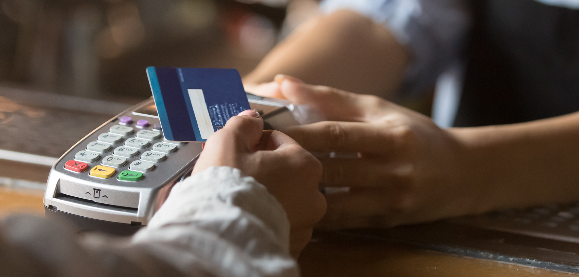 hand swiping credit card