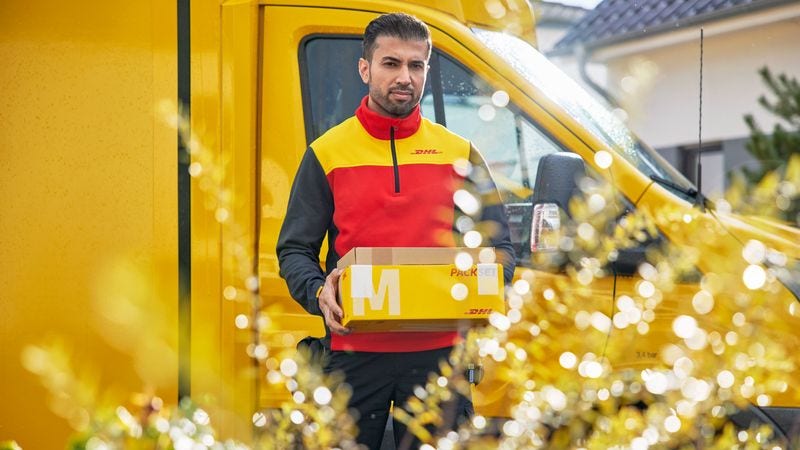 dhl staff delivering parcels shipped from cambodia to singapore