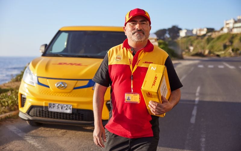 dhl express australia employee delivering a parcel