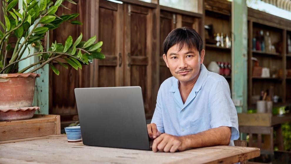 e-commerce business owner reviewing website seo on a laptop
