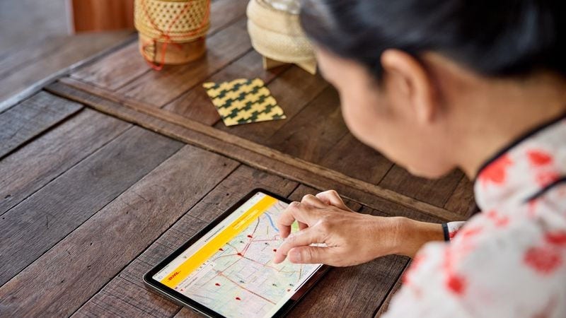 A businesswoman tracking her express shipping deliveries