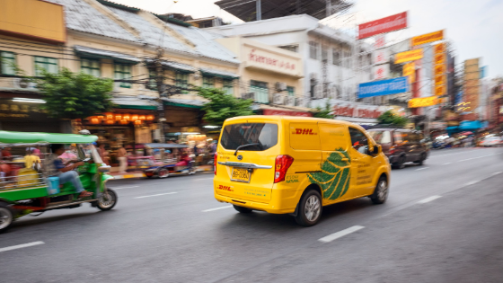 dhl delivery van on the road