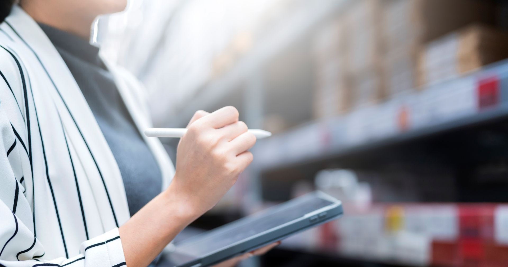 A medical logistics company’s employee doing a stock check of their products